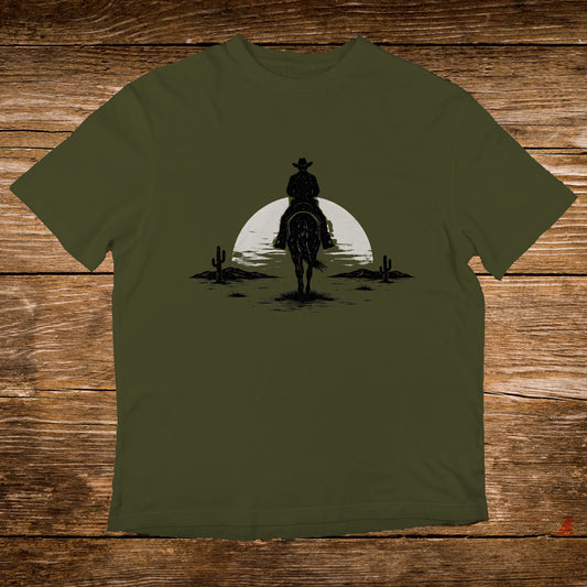 Silhouette of a cowboy on horseback against a desert sunset.