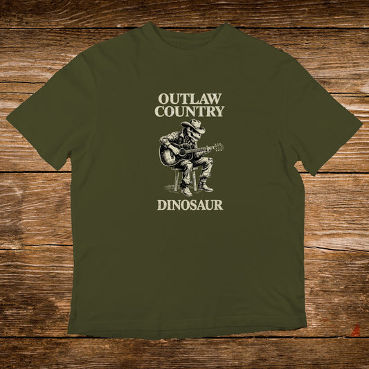 Green t-shirt with "Outlaw Country Dinosaur" graphic of a dinosaur playing guitar.