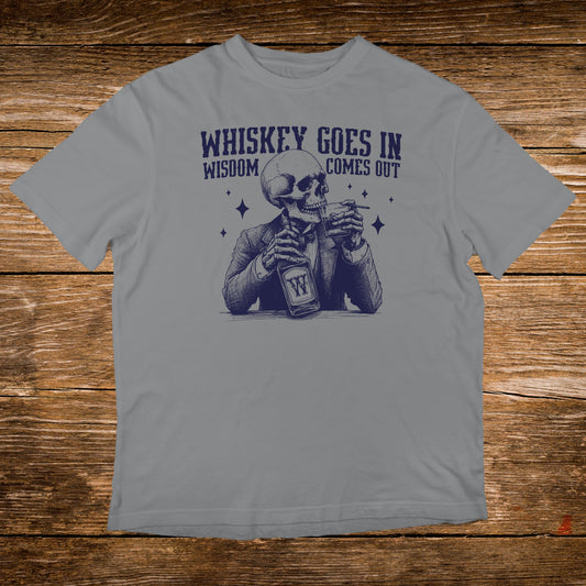 Skeleton in a suit drinking whiskey, text reads "Whiskey goes in, wisdom comes out."