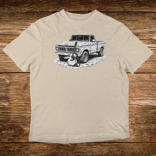 T-shirt graphic of a vintage pickup truck with an acoustic guitar.