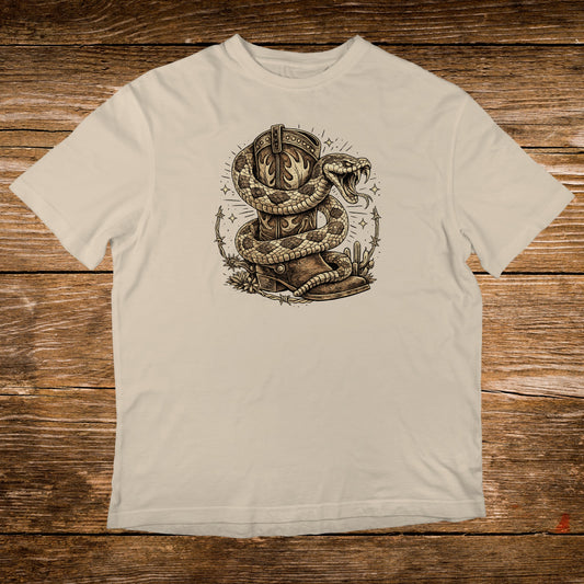Western boot with snake coiled around it, on wood background.