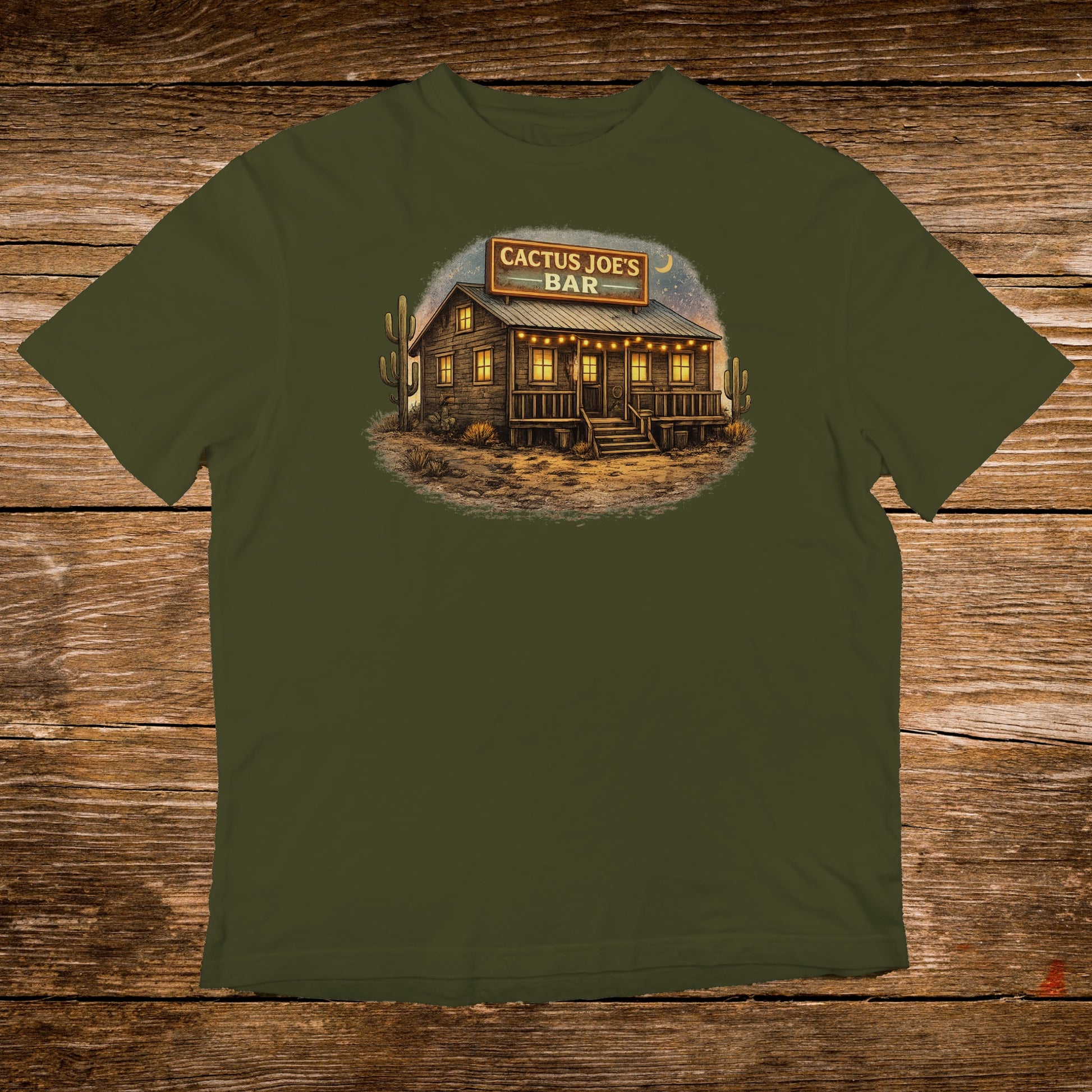 Green t-shirt with Cactus Joe's Bar nighttime desert scene graphic.