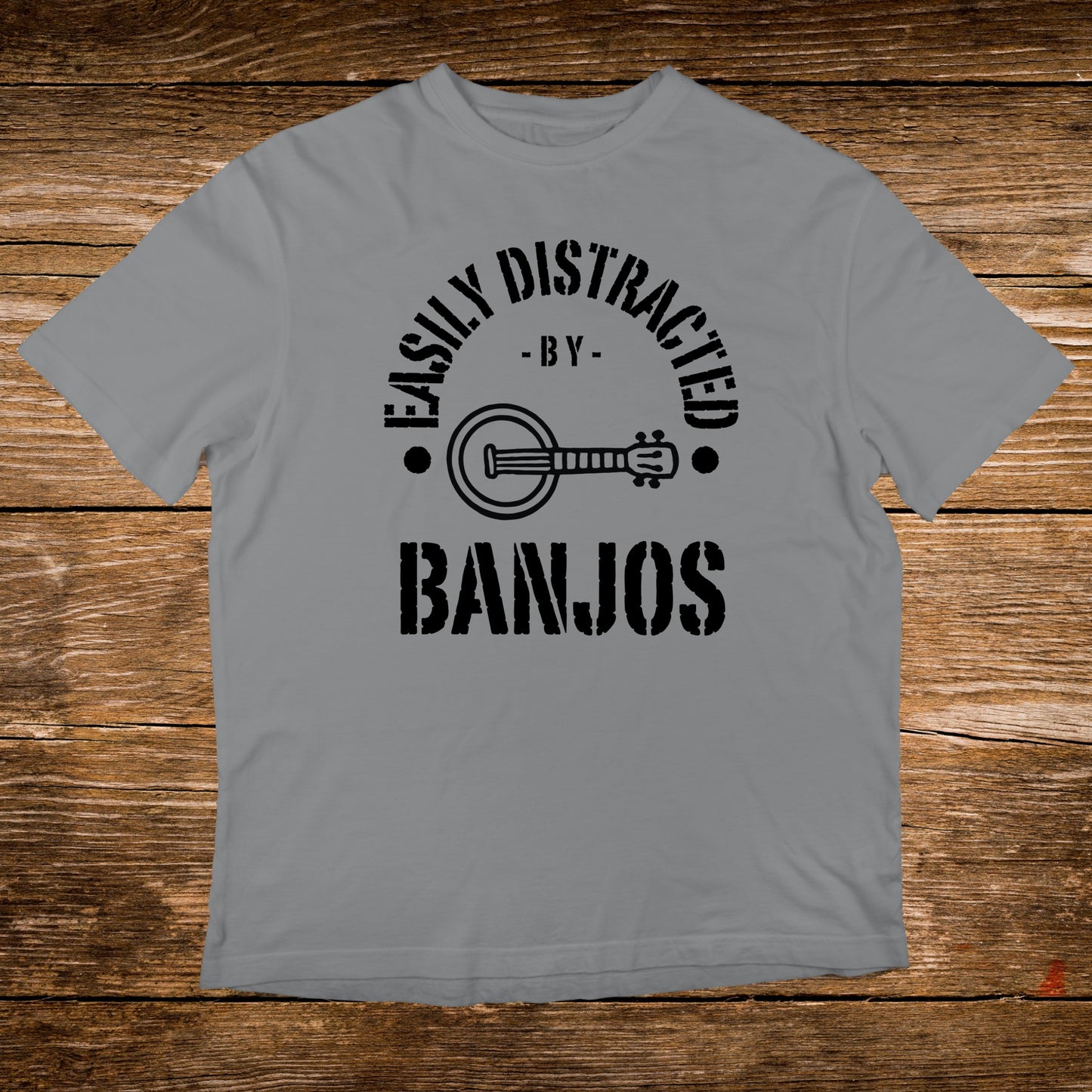 Gray t-shirt with black text "Easily Distracted By Banjos" and banjo graphic.