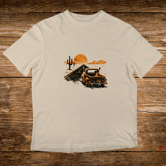 Vintage truck with guitar on road with desert landscape and sunset.