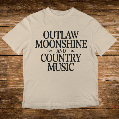 Cream t-shirt with black text "OUTLAW MOONSHINE AND COUNTRY MUSIC".