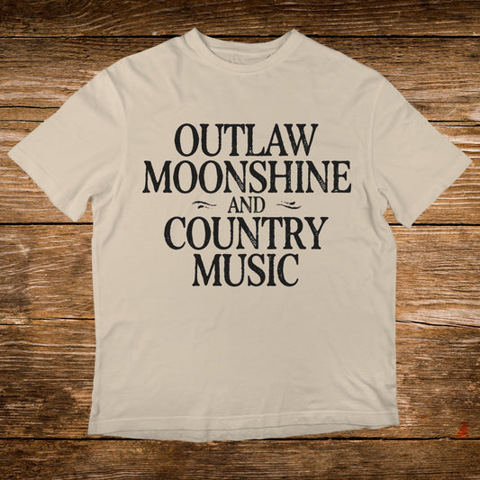 Cream t-shirt with black text "OUTLAW MOONSHINE AND COUNTRY MUSIC".