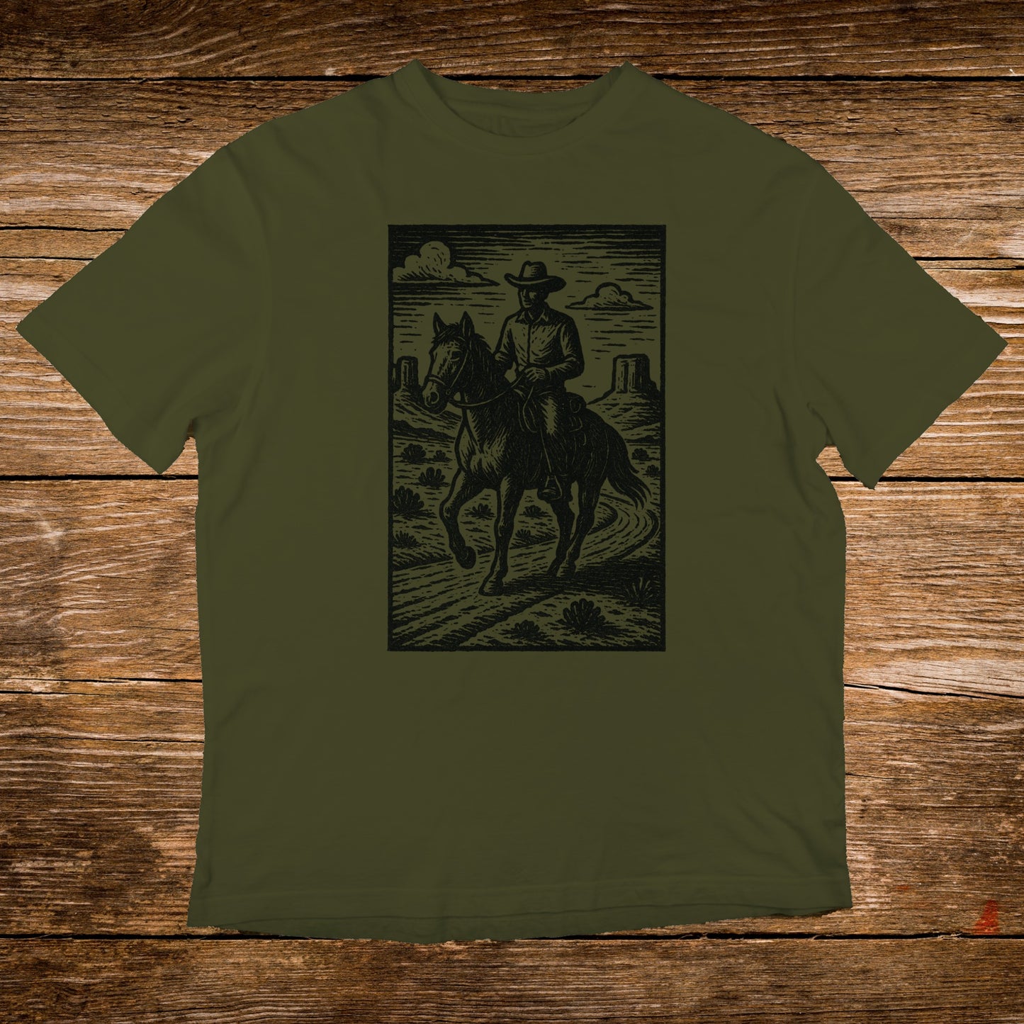 Cowboy on horseback rides through a desert landscape with mountains.