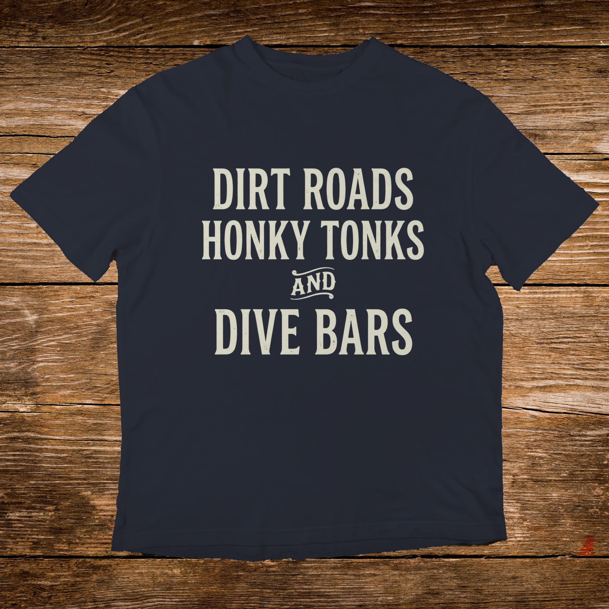 Navy t-shirt with "Dirt Roads Honky Tonks AND Dive Bars" text.