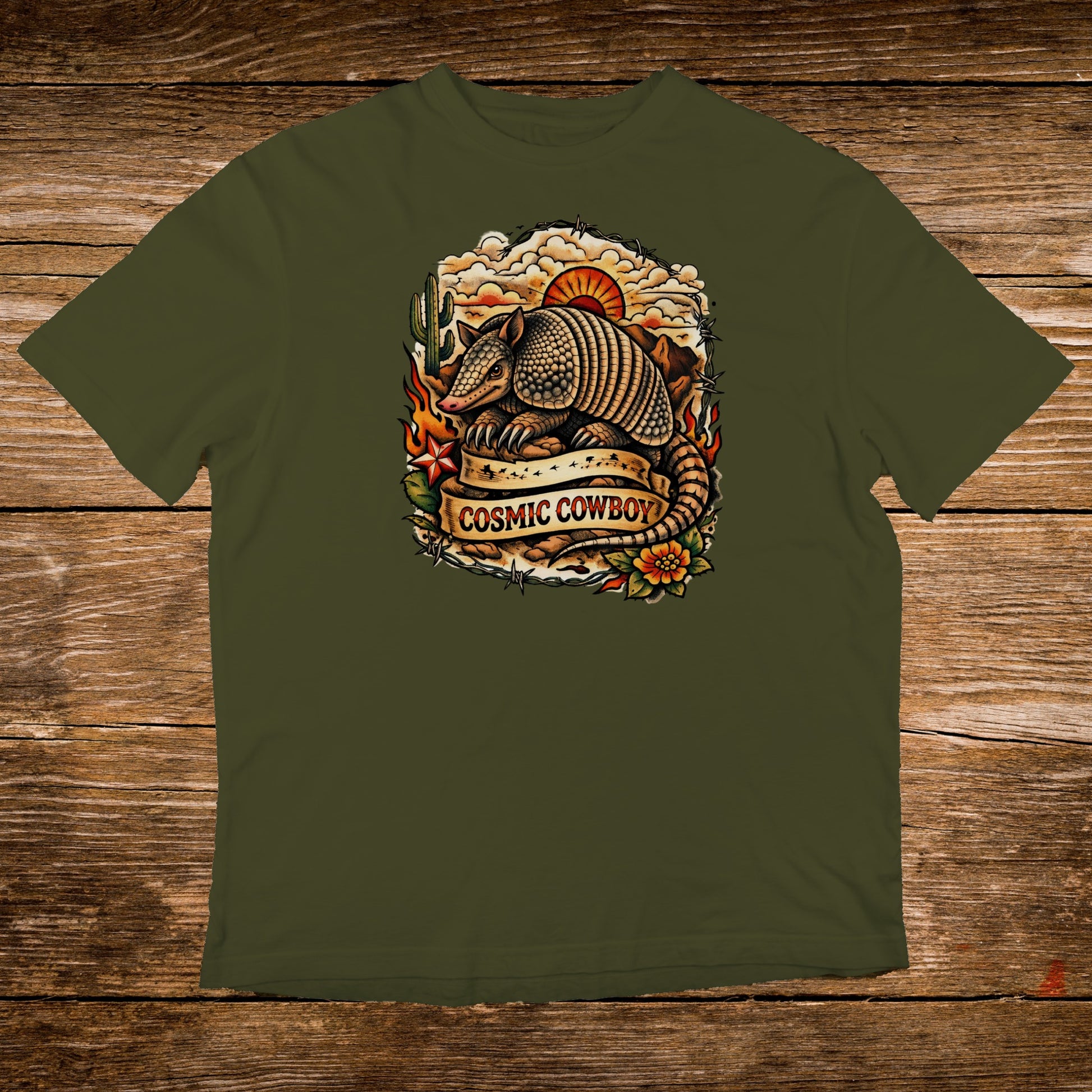 Armadillo with "Cosmic Cowboy" text on a vintage-style graphic on an olive green t-shirt.