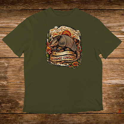 Armadillo with "Cosmic Cowboy" text on a vintage-style graphic on an olive green t-shirt.