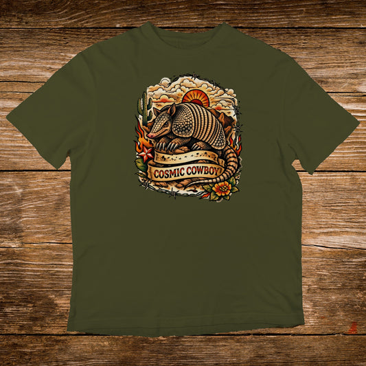 Armadillo with "Cosmic Cowboy" text on a vintage-style graphic on an olive green t-shirt.