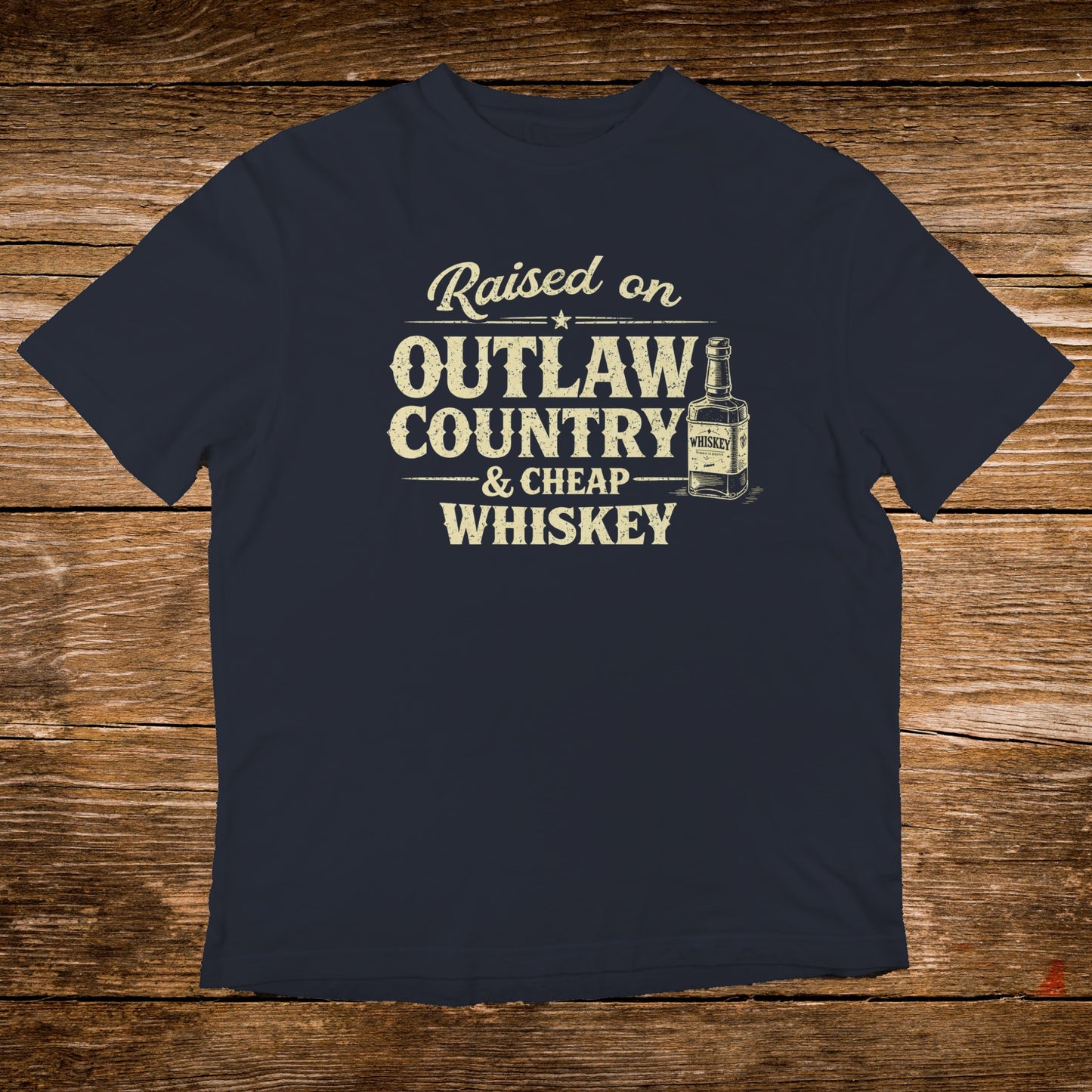Navy t-shirt with "Raised on Outlaw Country & Cheap Whiskey" text and bottle graphic.