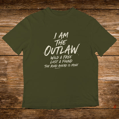 Olive t-shirt with white text reading "I AM THE OUTLAW WILD & FREE LOST & FOUND THE ROAD AHEAD IS MINE".