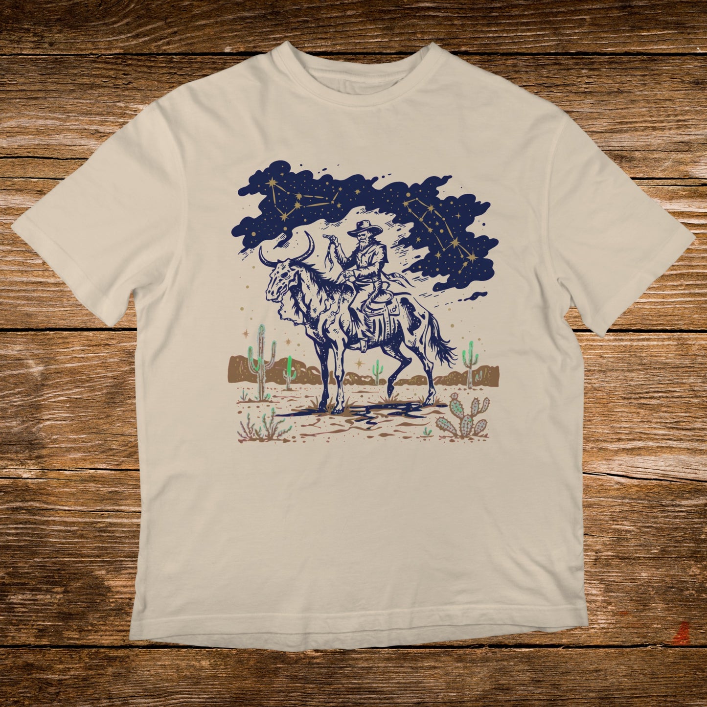 Cowboy on horseback under starry sky with desert landscape.