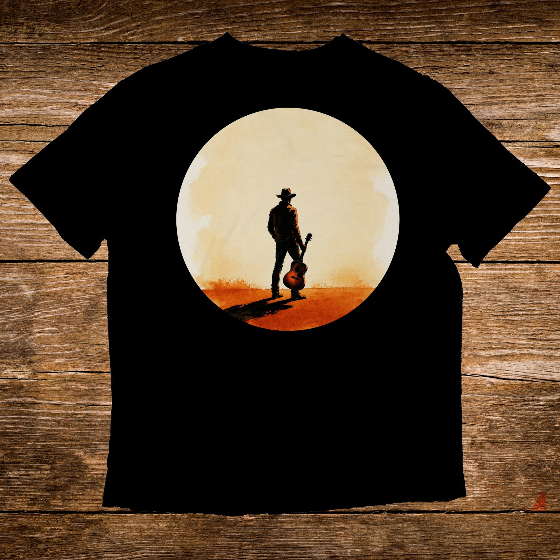 Black t-shirt with a cowboy holding a guitar silhouetted against a large circle.