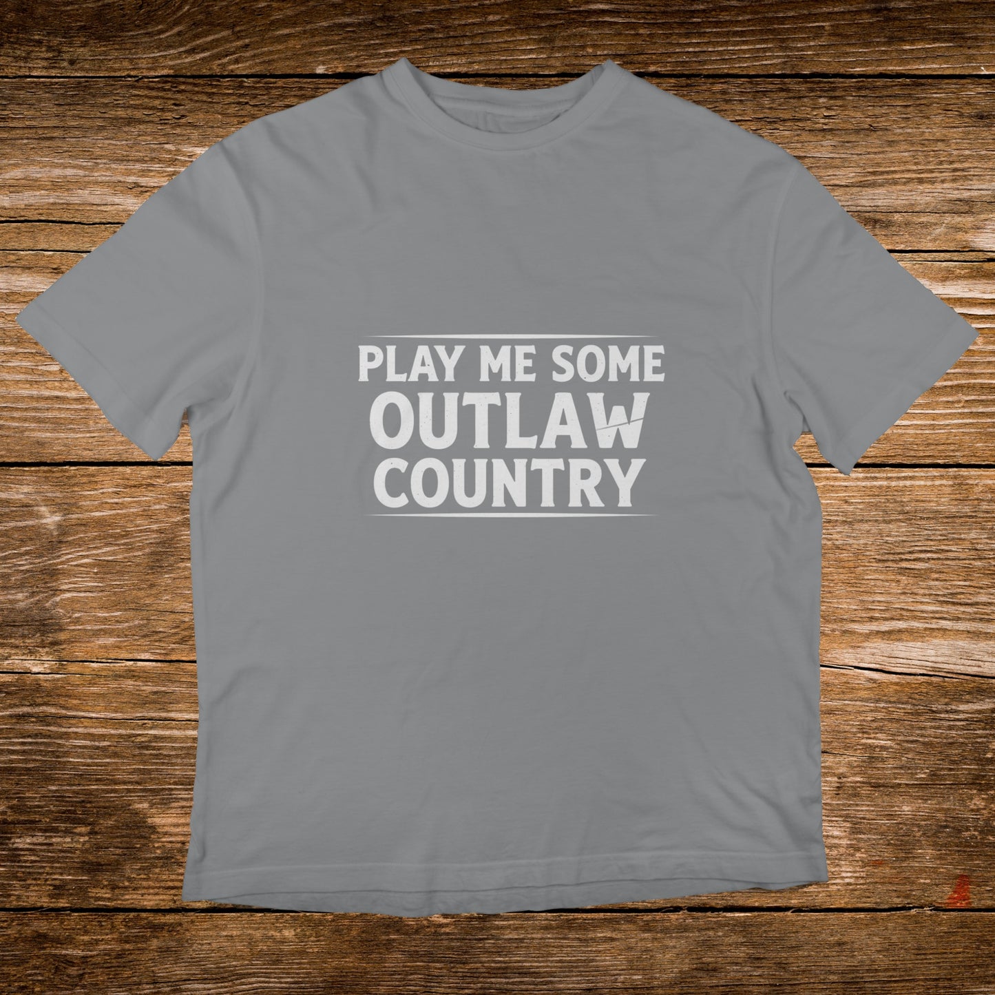 Gray t-shirt with white text "PLAY ME SOME OUTLAW COUNTRY".