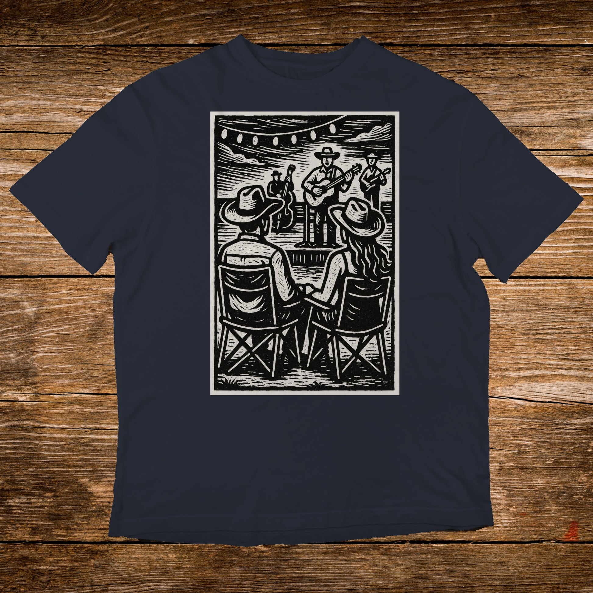 T-shirt with a linocut illustration of a live band playing outdoors.