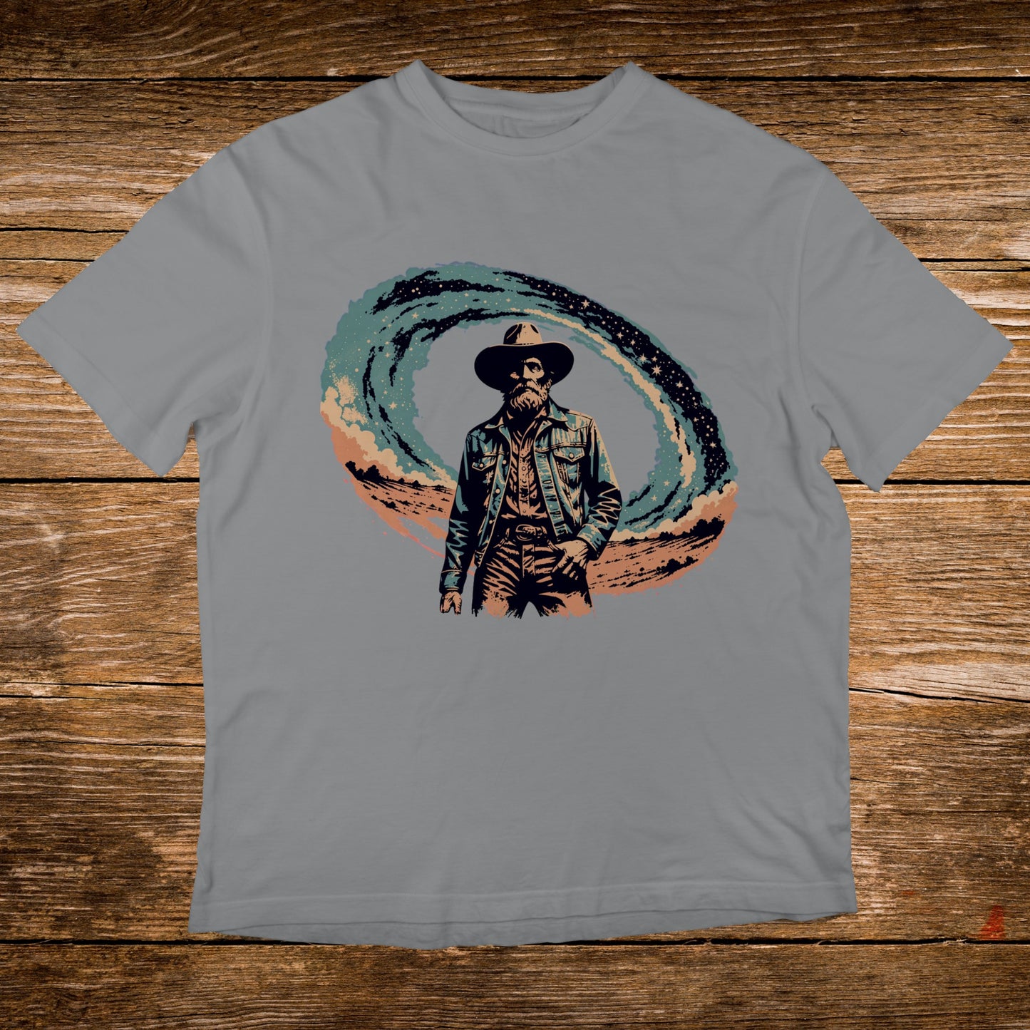 Cowboy in a swirling cosmic background on a grey t-shirt.