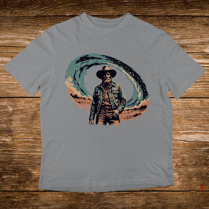 Cowboy in a swirling cosmic background on a grey t-shirt.