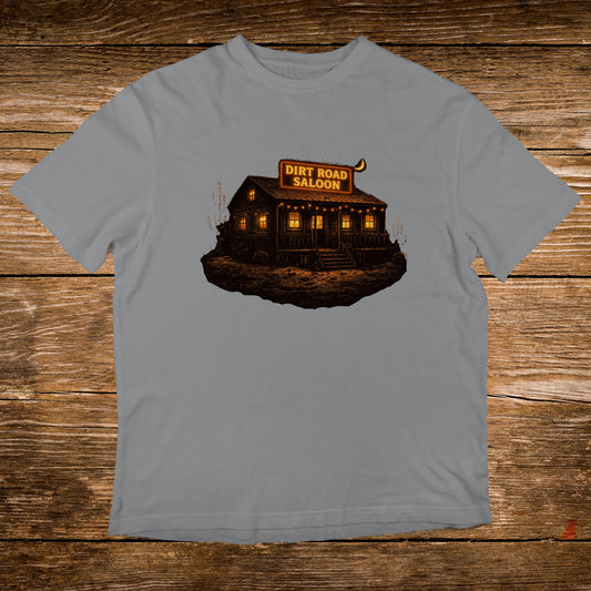 T-shirt featuring a vintage "Dirt Road Saloon" illustration with warm lighting.