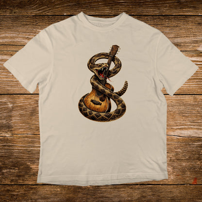 Rattlesnake coiled around acoustic guitar on a cream t-shirt.