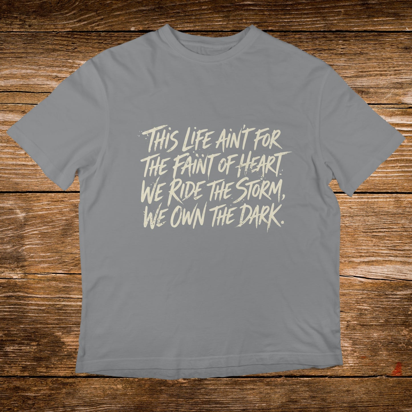 Grey t-shirt with "This life ain't for the faint of heart. We ride the storm, we own the dark."