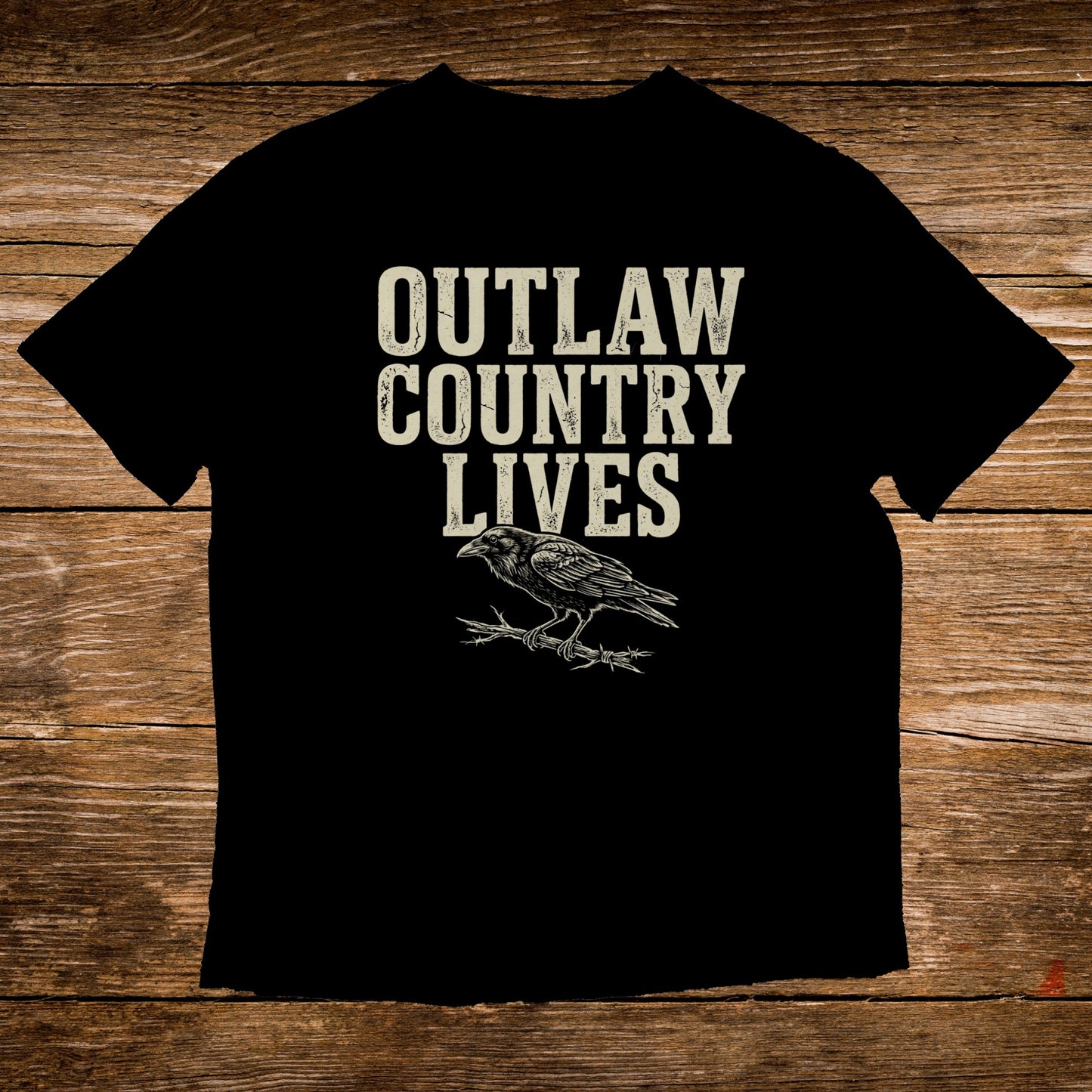 Black t-shirt with "Outlaw Country Lives" text and a raven on a branch.