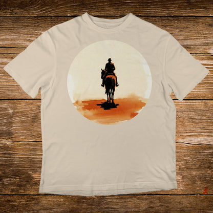 Cowboy on horseback silhouetted against a large orange sun.