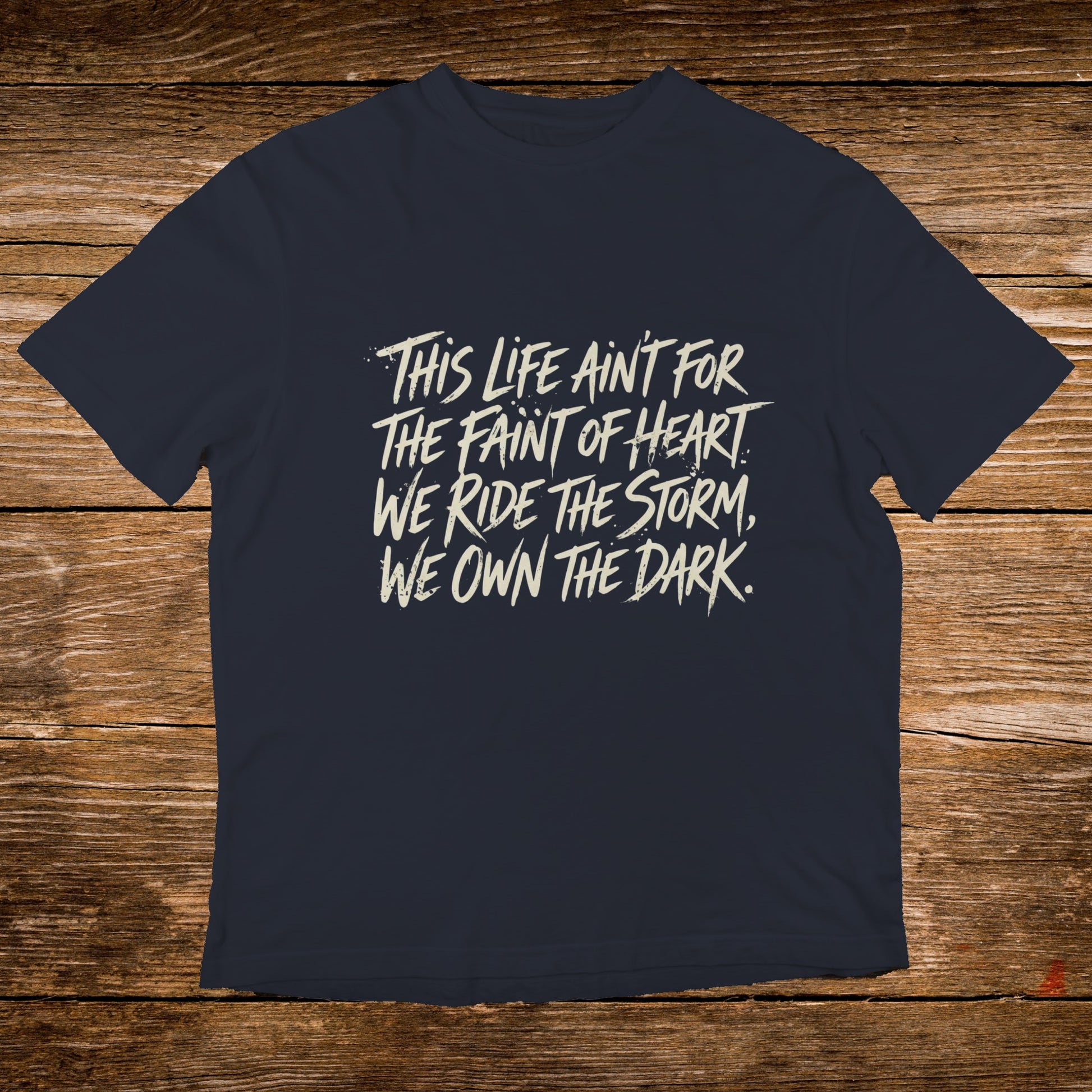 Navy t-shirt with white text reading "This life ain't for the faint of heart. We ride the storm, we own the dark."