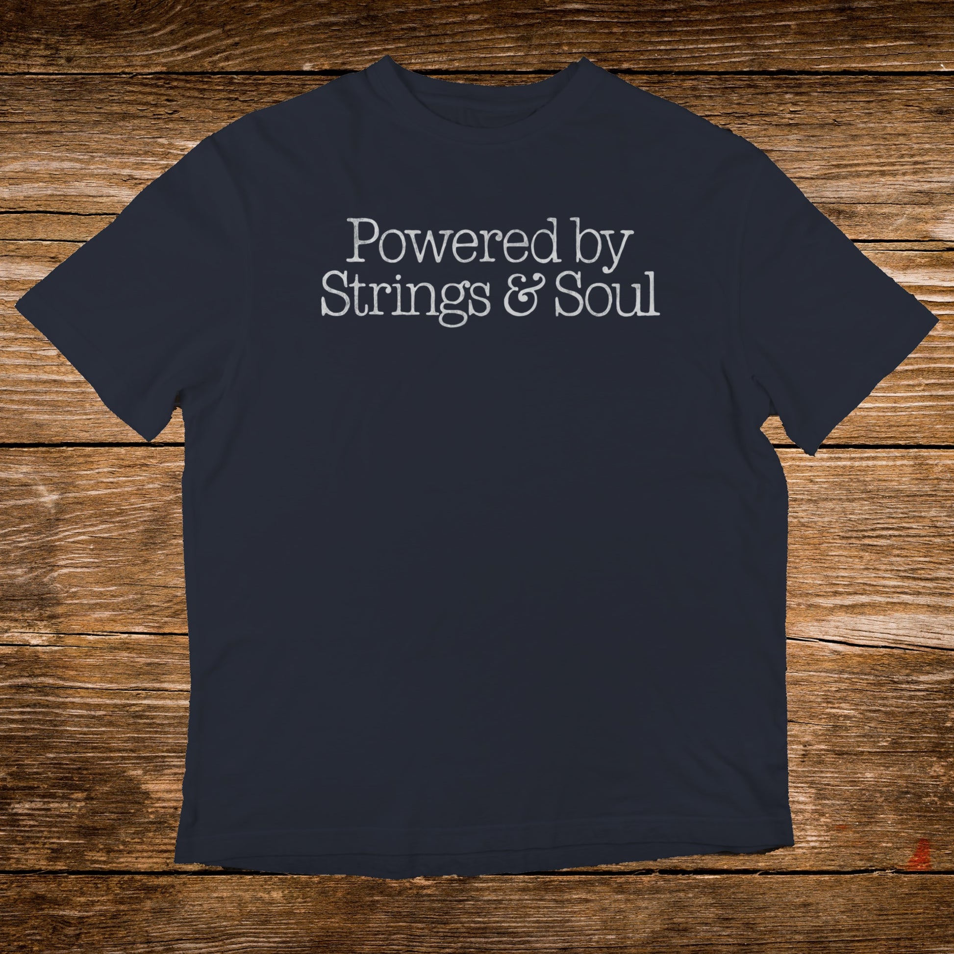 Dark t-shirt with "Powered by Strings & Soul" in light gray text.