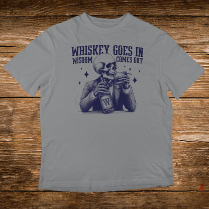 Skeleton in a suit drinking whiskey, text reads "Whiskey goes in, wisdom comes out."