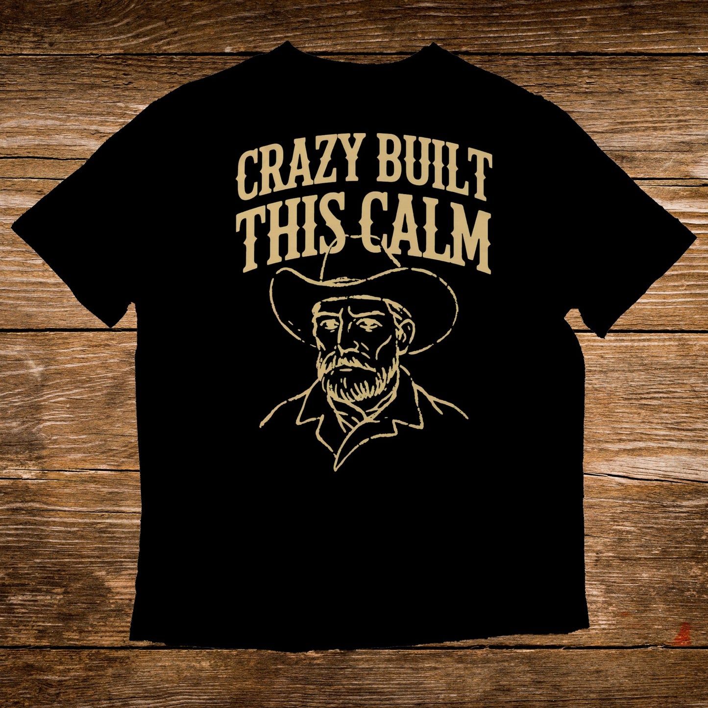 Black t-shirt with "CRAZY BUILT THIS CALM" and cowboy graphic.
