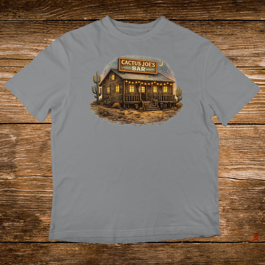 T-shirt graphic featuring "CACTUS JOE'S BAR" sign above a rustic building with cacti.