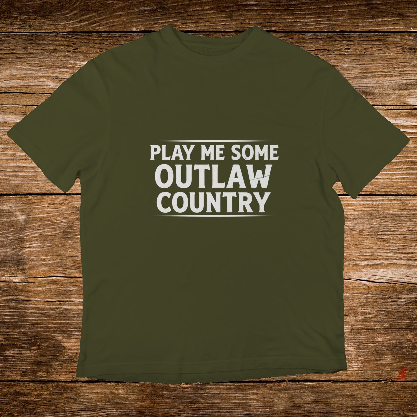 Olive green t-shirt with white text reading "PLAY ME SOME OUTLAW COUNTRY".