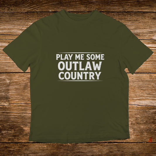 Olive green t-shirt with white text reading "PLAY ME SOME OUTLAW COUNTRY".