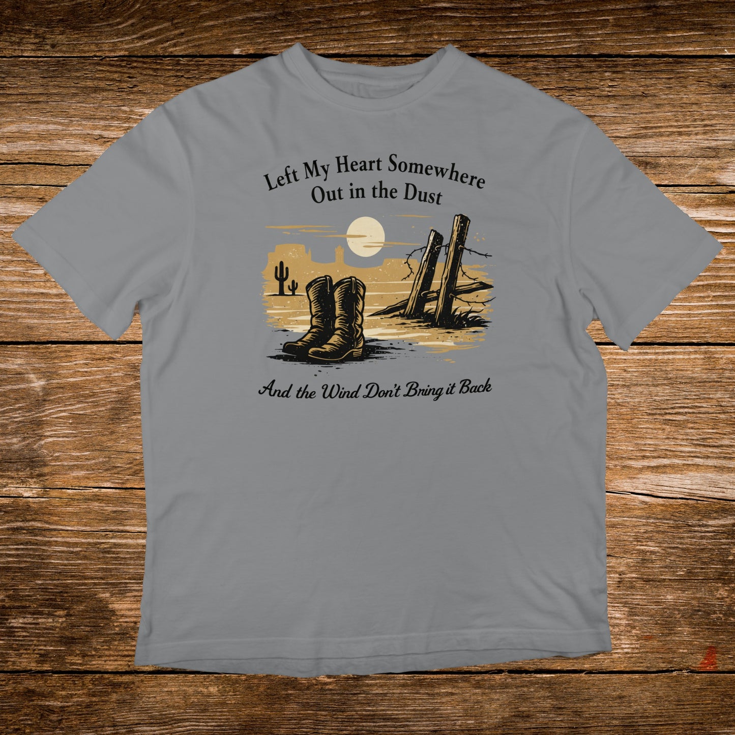 Western boots and fence post with desert landscape, text reads "Left My Heart Somewhere Out in the Dust And the Wind Don't Bring it Back".