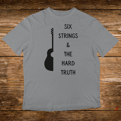 Grey t-shirt with "SIX STRINGS & THE HARD TRUTH" and guitar graphic.