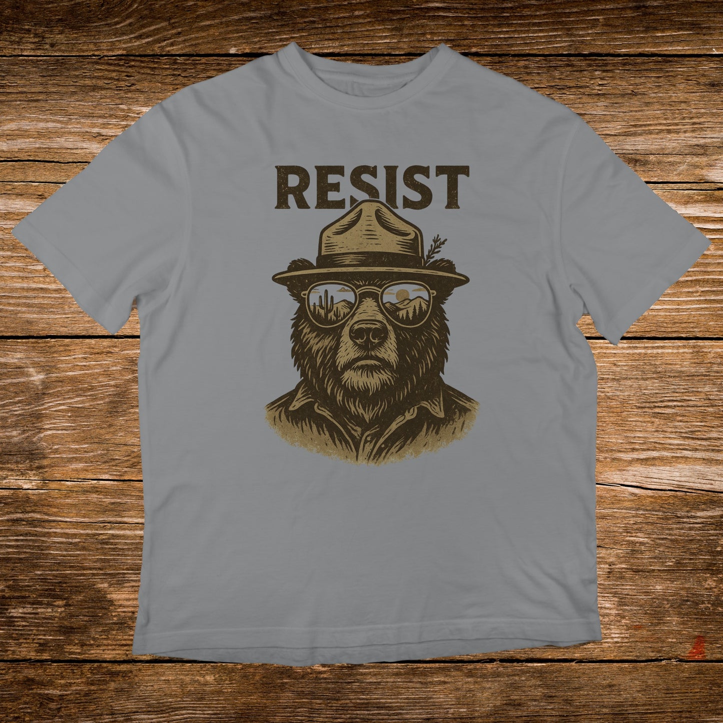 Bear wearing a ranger hat and sunglasses with the word "RESIST".