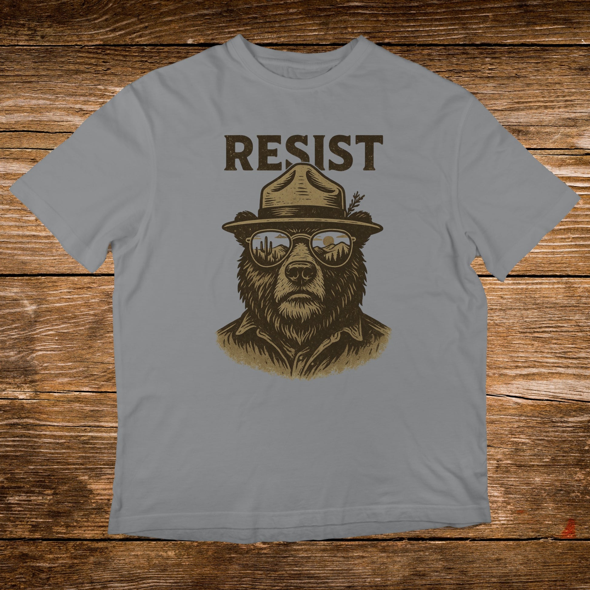 Bear wearing a ranger hat and sunglasses with the word "RESIST".
