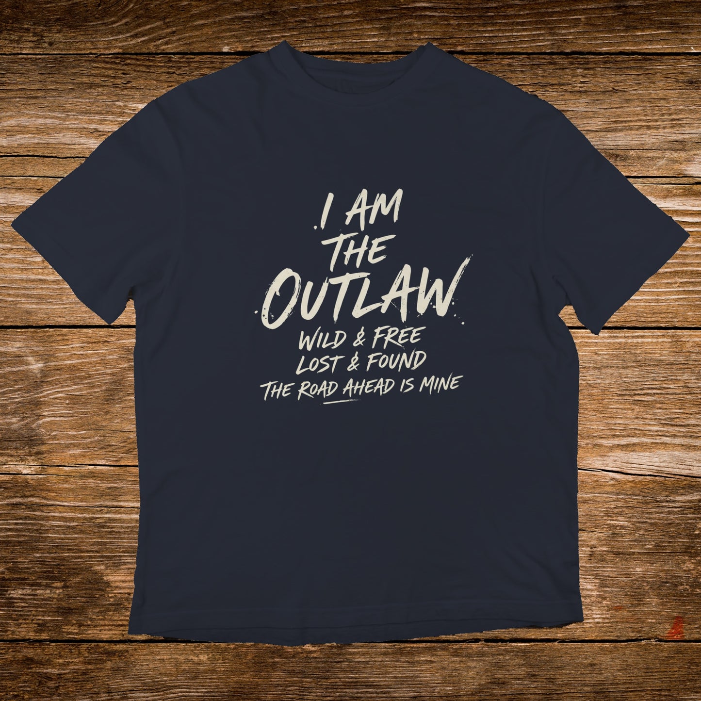 Navy t-shirt with "I AM THE OUTLAW WILD & FREE LOST & FOUND THE ROAD AHEAD IS MINE" text.