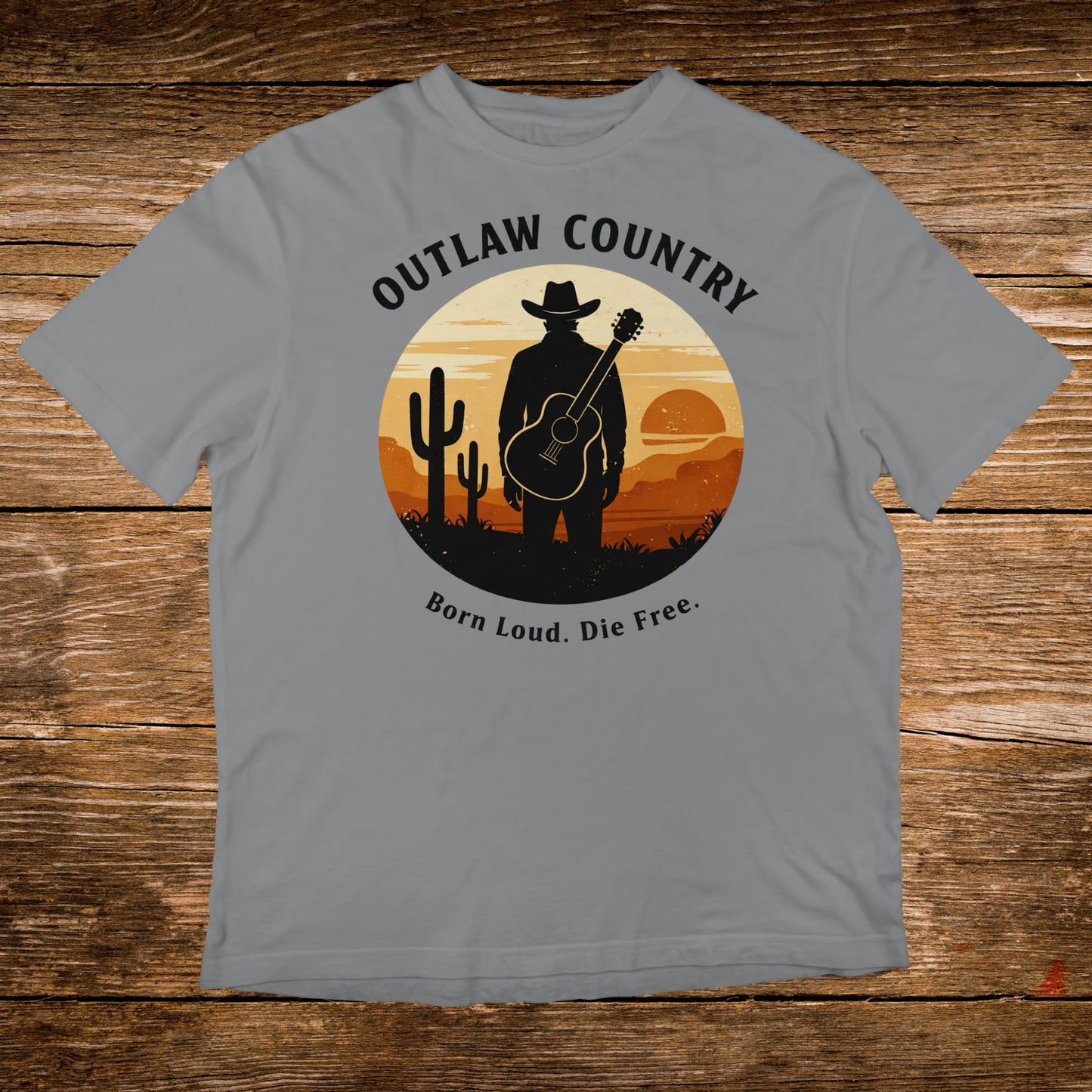 Gray t-shirt with "Outlaw Country" and guitar silhouette in desert sunset.