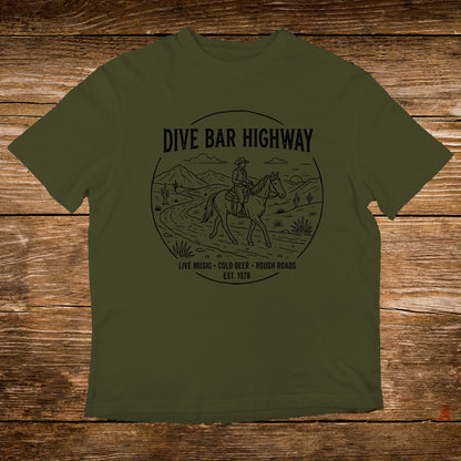 Olive t-shirt with "Dive Bar Highway" design featuring a cowboy on horseback.