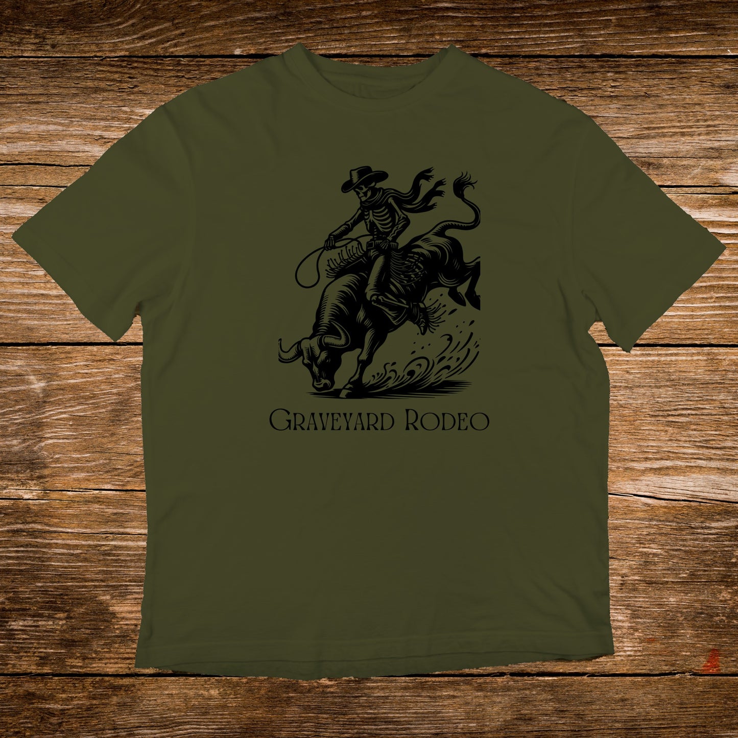Olive green t-shirt with "Graveyard Rodeo" text and a skeleton riding a bull graphic.