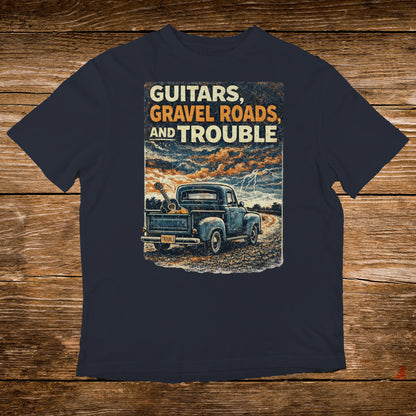 Blue pickup truck with guitars and a stormy sky, "Guitars, Gravel Roads, and Trouble" text.