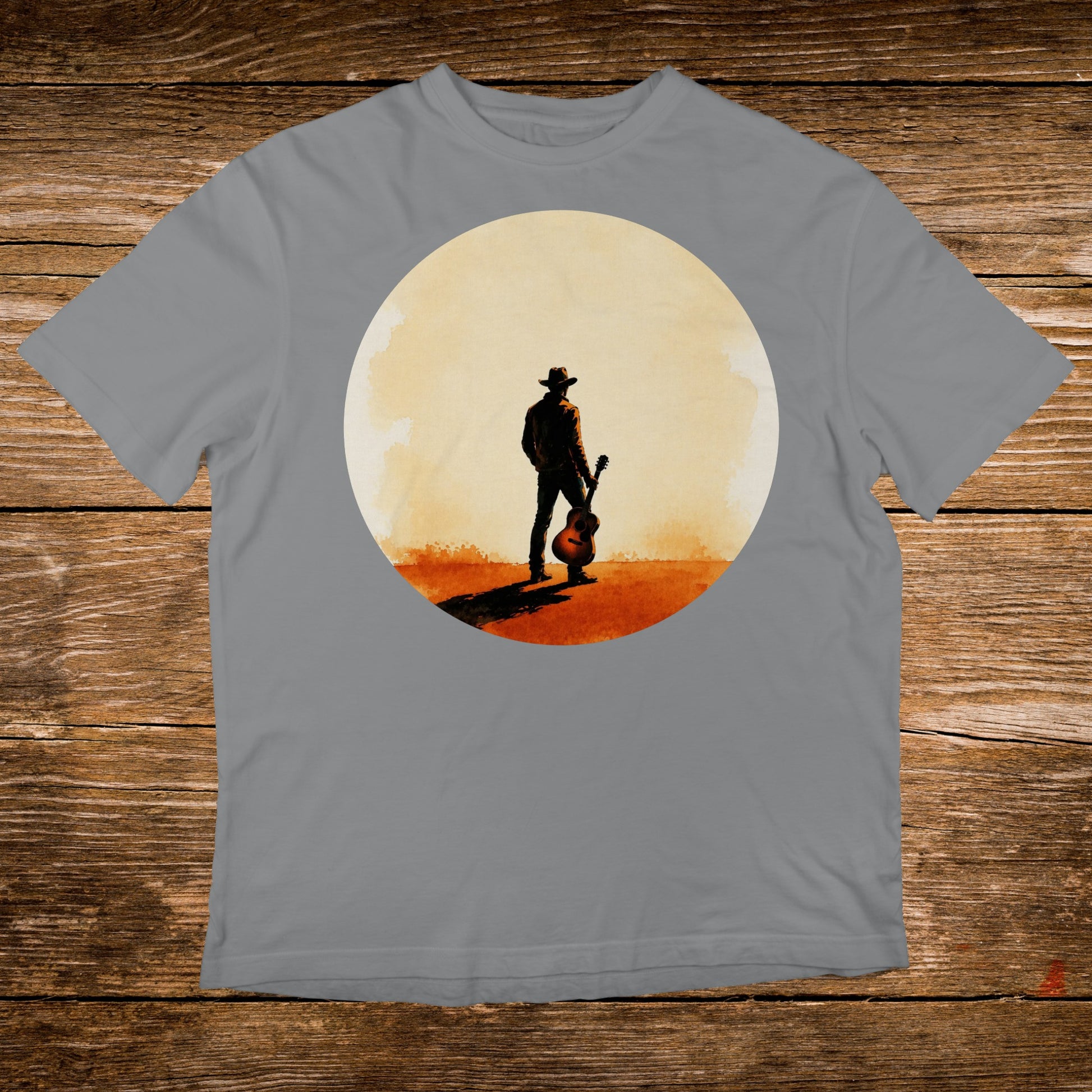 Cowboy with guitar silhouetted against a large, pale sun.