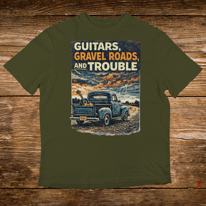 Blue pickup truck with guitars in bed, storm sky, "Guitars, Gravel Roads, and Trouble" text.