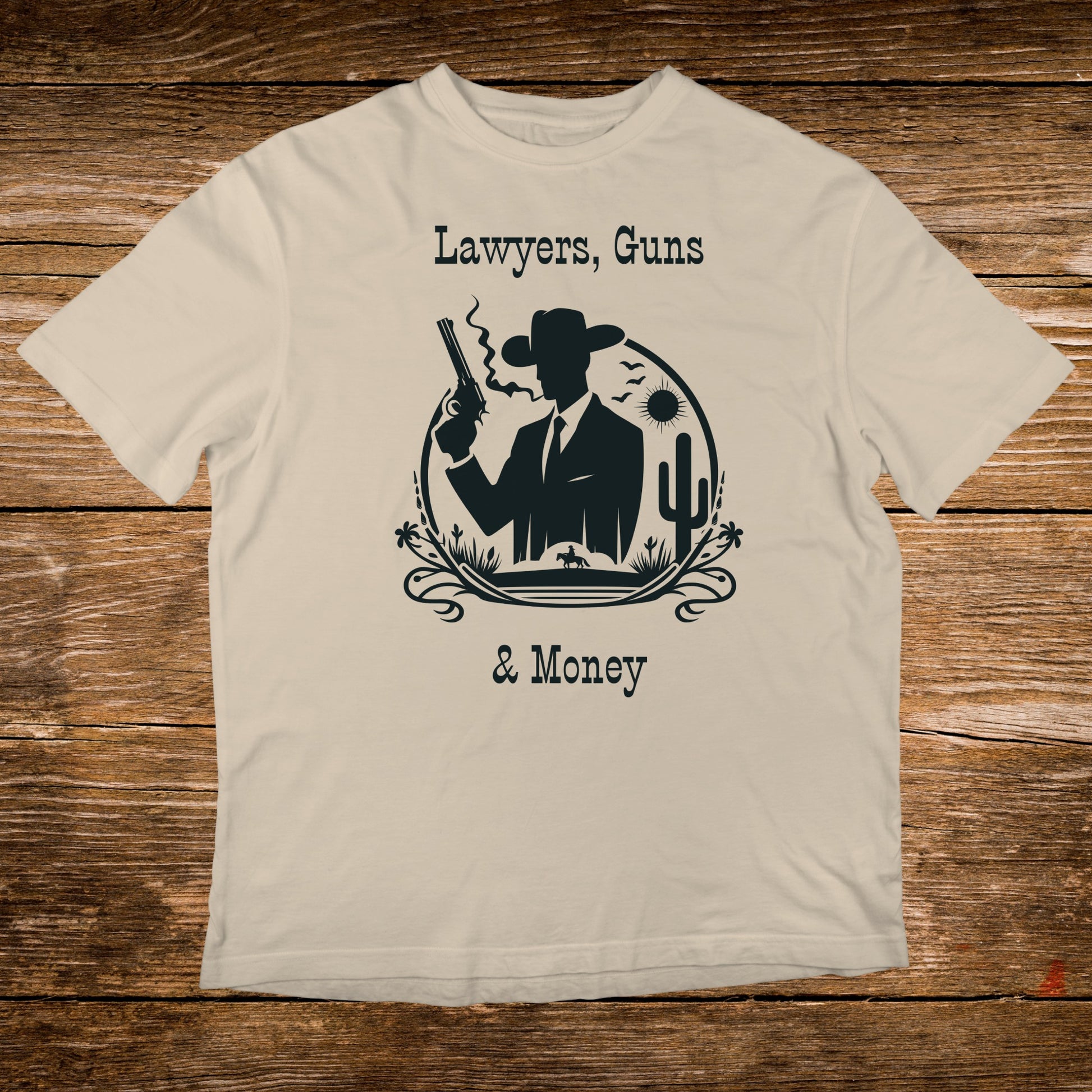 T-shirt with silhouette of cowboy, gun, cactus, and text: Lawyers, Guns & Money.