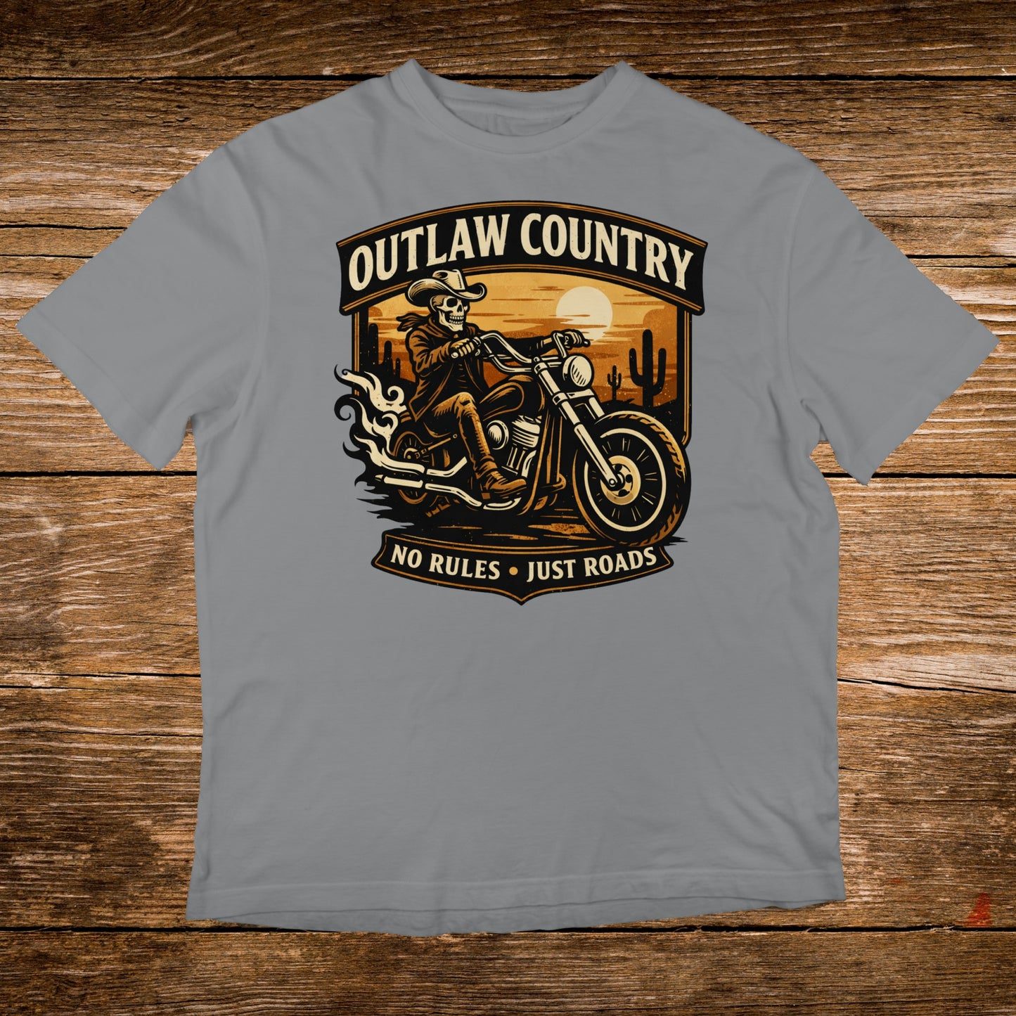 Outlaw Country skull rider on motorcycle with text, sunset desert background.