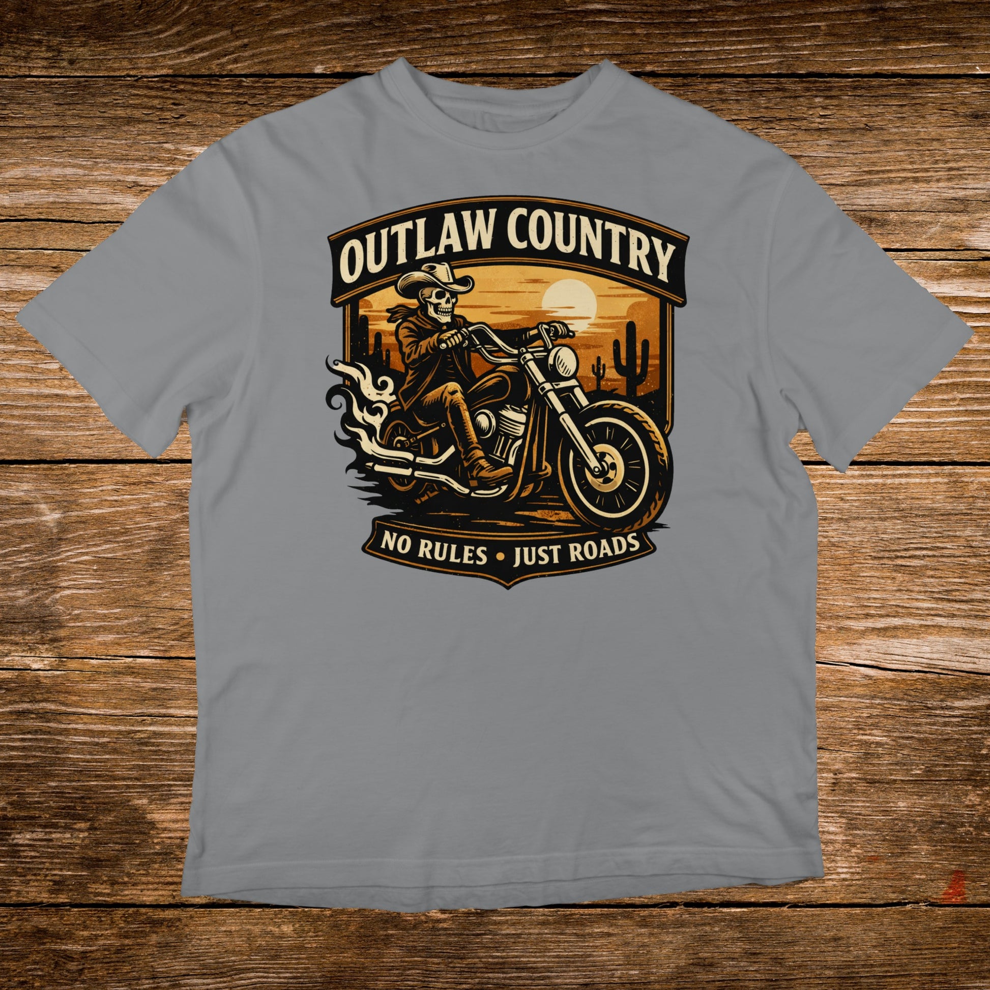 Outlaw Country skull rider on motorcycle with text, sunset desert background.