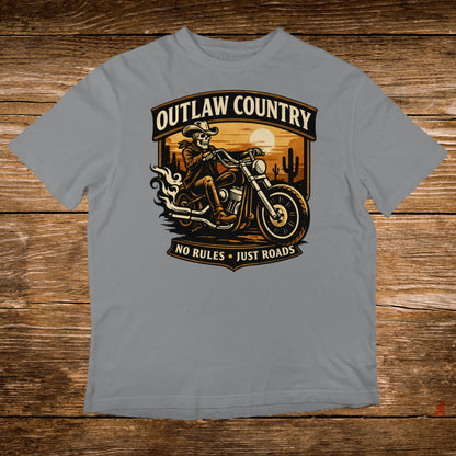 Outlaw Country skull rider on motorcycle with text, sunset desert background.